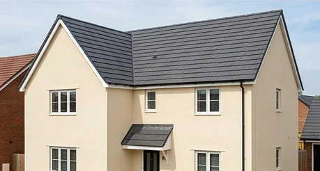 Different illustrative cream house with a uniform charcoal mineral tile roof