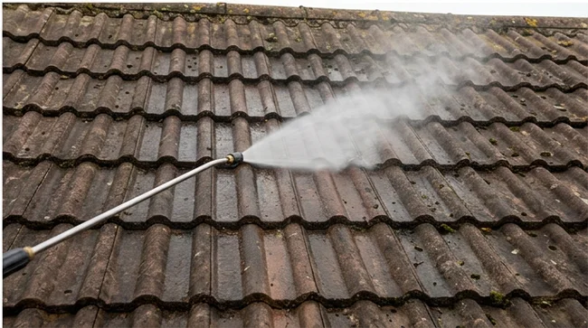 Gentle treatment spray applied to brown concrete roof tiles