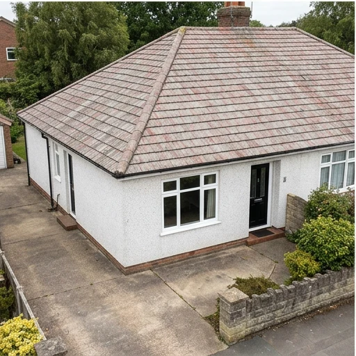 Different illustrative white rendered bungalow with faded reddish grey concrete roof tiles
