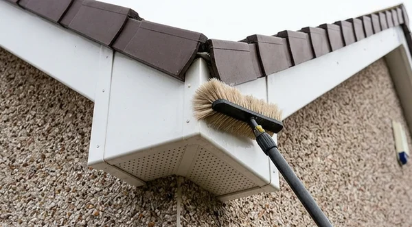 Soft brush washing white fascia and soffit